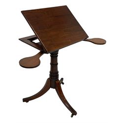 George III mahogany reading table, the rectangular hinged top with an adjustable ratchet support, flanked by twin pivotal pull-out candle slides, raised on a ring turned column pedestal terminating in a splayed support tripod base with brass castors