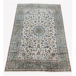  Persian Kashan ground carpet, with floral medallion and trailing foliate on ivory field, triple guarded border, 415cm x 280cm  