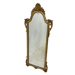 Regency design gilt framed wall mirror, the central shell pediment with extending foliate decoration and C-scrolls