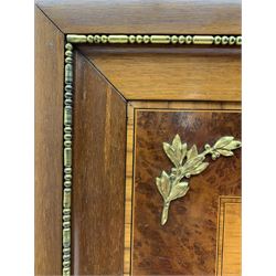 Early 20th century French mahogany and amboyna wood picture frame, the rectangular frame mounted by gilt metal floral wreath casting with extending ribbons, two inner rectangular satinwood panels with oval portrait apertures, gilt metal floral mounts to each corner, enclosed by satinwood band and metal beading 