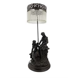 Bronzed resin table lamp with two figures and tasselled shade H75cm