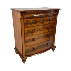 Late 19th century mahogany bow-front chest, fitted with banded cushion drawer with secret catch, above two short over three long graduating drawers, each cock-beaded with turned handles, lower moulded edge over turned feet