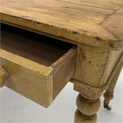  Victorian scumbled pine kitchen table, with two frieze drawers raised on turned supports and ceramic castors, W119cm x 59cm, H76cm  