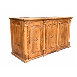 Early 20th century French pine shop counter, three fielded panelled doors enclosed by half round turned pilasters, opposite twenty seven shelves W169cm, H93cm, D70cm