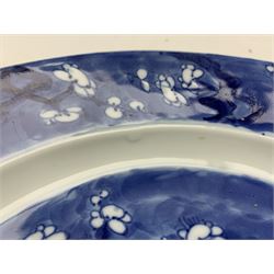 18th century Chinese kangxi blue and white plate, painted in the centre with flowering prunus beneath a blossom border, with six figure mark to reverse W26.5cm