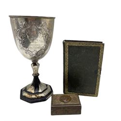 Jewellery box formed as a velvet lined leather bound book with tooled spine 16cm x 10cm, metal box with polychrome lid and an Indian white metal challenge cup 'Middleton Cup - Calcutta Sky Races 1879 H22cm
