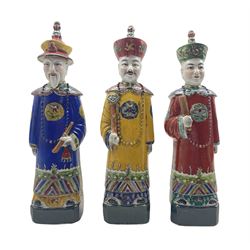 Three Chinese Republic figures 'The Three Emperors', each dressed in yellow, red and blue robes, some a/f H38cm 
