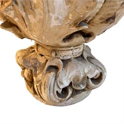 Cast plaster Cartouche urn planter, in the form of scrolling foliage with globular decorative band, on scrolled leaf cast footed base