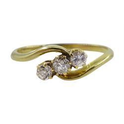 Gold three stone diamond crossover ring, stamped 18ct, total diamond weight approx 0.25 carat