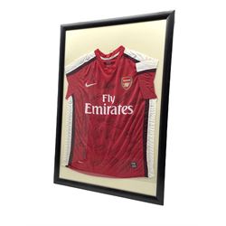 Nike souvenir Arsenal football jeresy signed by Manuel Almunia, Bacary Sagna, William Gallas, Mikael Silvestre, Gael Clichy, Alex Song, Carlos Vela and others, framed with certificate of authenticity verso 99cm x 68cm overall