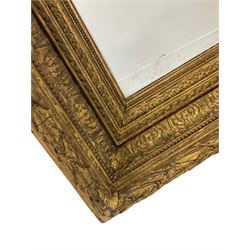 Late 19th century large gilt framed mirror, the stepped frame decorated with repeating acanthus leaves, ribbons and beading