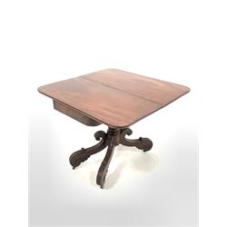 Late Georgian Irish mahogany tea table, the fold over revolving top over waterleaf carved and turned column, raised on four 's' scrolled and leaf caved supports terminating in castors W91cm
