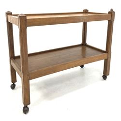 Peter 'Rabbitman' Heap of Wetwang -Yorkshire oak two tier tea trolley, each tier with adzed finish, raised on square supports with canted corners and castors, with carved rabbit signature 87cm x 39cm, H70cm