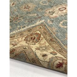 Persian design ground rug, blue field with interlaced floral design, enclosed by an ivory guarded boarder. W120cm L195cm.