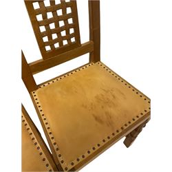 'Mouseman' set four oak dining chairs, lattice carved back, upholstered in tan leather with studded band, carved with mouse signatures, by Robert Thompson of Kilburn