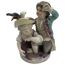 Meissen porcelain group modelled as two cherubs playing with a goat, the oval scroll moulded base heightened in gilt, blue crossed swords, inscribed no. 2454, H10cm, together with a Meissen figure of a young girl and boy, possibly emblematic of autumn, unmarked, (2) Provenance: From the Estate of the late Dowager Lady St Oswald