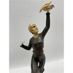 Art Deco style bronzed statue of woman holding parrot mounted on an onyx base after Paul Phillipe H40cm