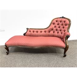 Victorian rosewood chaise longue, the shaped crest rail with floral carved pediment and scrolled terminals, button back and seat upholstered in patterned pale red silk, raised on scrolled cabriole supports terminating in castors, L160cm