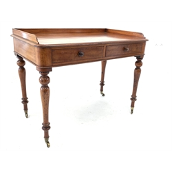  Victorian mahogany side table, three quarter galleried top over two frieze drawers, raised on turned supports with brass cup castors, 105cm x 60cm, H80cm  