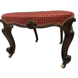 Victorian mahogany nursing or hall chair, pierced and carved cresting rail with central cartouche flanked by finials, rope twist uprights, seat and back upholstered in crimson fabric, the frieze rail with central shell motif, raised on scrolled cabriole supports with ceramic castors