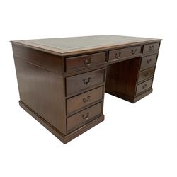 Mahogany twin pedestal desk, moulded rectangular top with leather inset, fitted with seven drawers