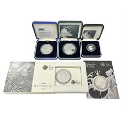 The Royal Mint United Kingdom silver proof 2007 one ounce Britannia, silver proof 2007 twenty-pence Britannia, silver proof 2000 five pound coin, all cased with cert, and two one ounce fine silver Britannia coins dated 2008, 2010 in card holders