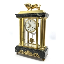 Late 19th century Empire design four glass, brass and marble mantel clock, surmounted by brass lion, over four reeded columns, stepped marble base embellished with gilt metal mounts depicting swans and scrolled foliate, raised on cast brass supports, the white enamel dial with Roman numeral chapter ring over sunburst pendulum, eight day twin spring driven movement, stamped 'H & C PARIS', W28cm