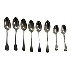 Pair of George III silver fiddle pattern table spoons London 1817 Maker John Lias, three table spoons London 1925, single George III table spoon and two dessert spoons 16.7oz