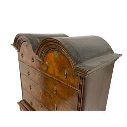 Early 18th century walnut double-domed chest-on-stand, the stepped moulded cornice above two arched short and three long graduating drawers, each with feather stringing, the base fitted with three short drawers over a shaped apron, raised on cabriole supports terminating in pointed pad feet
Provenance: From the Estate of the late Dowager Lady St Oswald
