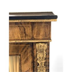 Victorian walnut pier cabinet, the top with applied gilt metal beaded moulding over box wood strung freize centred by a painted porcelain roundel, glazed door enclosing two shelves, with further gilt metal mounts to sides, raised on ebonised turned supports W77cm, H108cm, D35cm