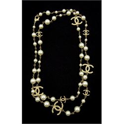 Chanel gilt faux pearl and 'CC' long necklace, the clasp stamped 09 A, with fabric pouch