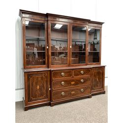 Large 20th century Sheraton design mahogany breakfront bookcase, projecting cornice over frieze with inlaid acorns, oak leaves and with boxwood and ebonised stringing, four glazed doors enclosing six shelves, the bottom section fitted with two short and two long drawers to centre, flanked by two panelled cupboards with further inlay, W278cm, H220cm, D68cm