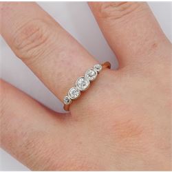 Early 20th century 18ct gold milgrain set five stone diamond ring, stamped, total diamond weight approx 0.40 carat