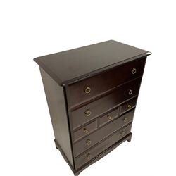 Stag Minstrel - mahogany chest of drawers, fitted with four long and three short drawers, raised on bracket supports 