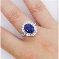 18ct white gold oval cut sapphire and round brilliant cut diamond cluster ring, sapphire approx 3.05 carat