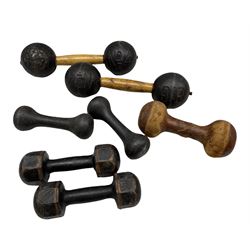 Two 19th/ early 20th century G.B. No. 4 cast iron dumbbells, a leather dumbbell and two other pairs 