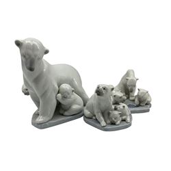 Three Lladro Polar Bears comprising  'Arctic Family' no. 6745, 'Polar Bear Miniature' no. 5434 and 'Bearly Love' no. 1443 (3)