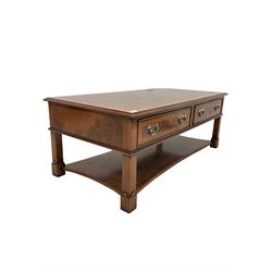 20th century figured walnut coffee table, the cross banded top with herringbone inlay over two drawers and two faux drawers, raised on square supports united by under tier with concave sides and further inlay W122cm, H46cm, D62cm