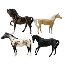 Royal Doulton horses comprising Appaloosa, Black Beauty, Palomino and another (4)