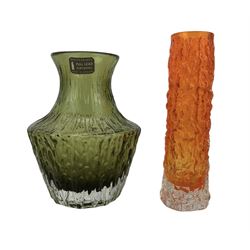 Two pieces of Whitefriars glass comprising tangerine orange bark finger vase, from the Textured range, pattern number 9729, H15cm and sage green 'Pot Bellied' vase pattern number 9832, with original label, both designed by Geoffrey Baxter (2)