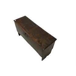 18th century oak six plank chest or coffer, the rectangular hinged lid with moulded edge, raised on V-shaped end supports