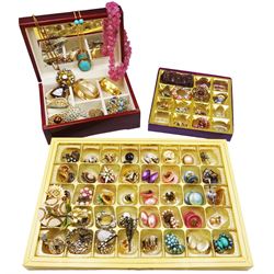 Collection of costume jewellery including two gold plated bangles, twenty-five brooches and over forty pairs of clip on earrings etc