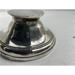 Silver circular capstan inkwell with hinged lid engraved with initials H6cm Birmingham 1924 Maker Deakin & Francis and a silver sauce boat with C scroll handle Sheffield 1916 (2)