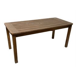 Stained teak garden table, the slatted top raised on square tapered supports 151cm x 71cm, H69cm
