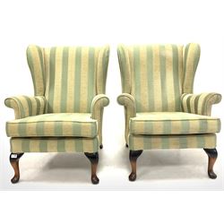 Pair of Queen Anne style wingback armchairs, upholstered in striped fabric, raised on cabriole front supports W76cm