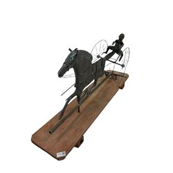 Copper and zinc weathervane in the form of a Horse and Sulky, mounted on wooden plinth L95cm