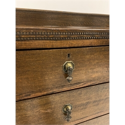 Early 20th century oak chest, two short and three long drawers, on turned supports with castors, W99cm, H124cm, D50cm
