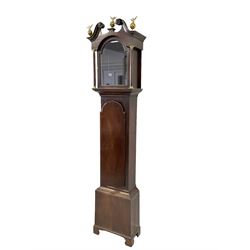 Late 18th-century empty mahogany longcase, with a swans neck pediment, matching brass eagle and ball finials and carved patera, break-arch hood door flanked by circular pilasters with brass capitals, long case door with a break arch top, rectangular plinth on a shaped base, dial mask measures 11-3/4 inches square and 16 inches to the top of the arch.