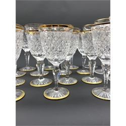 Part suite of Stuart Crystal Hardwicke pattern glasses with gilt rims, comprising ten large claret glasses and ten small claret glasses, together with a set of eight Spode crystal hock glasses with gilt rims (28)