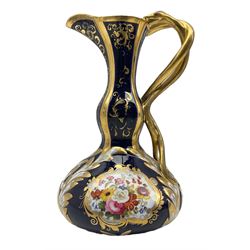 Late 18th century Chamberlains Worcester ewer, of squat form with slender neck and entwined serpent handle, the body with two reserves painted with floral sprays, on a cobalt blue and gilt low relief ground, with puce painted marks beaneath, H21cm 